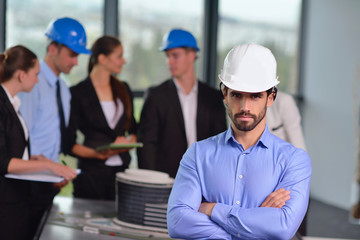 business people and construction engineers on meeting