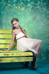 Beatifull teenage girl in vintage dress in studio