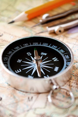 Compass and pencil on a map