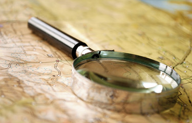 Magnifying glass lying on a map