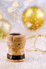 Champagne cork on Christmas lights background