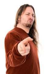 long-haired man is pointing in to the camera