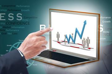 Business man showing financial chart on laptop