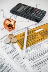 Polish income tax forms with calculator and piggybank - obrazy, fototapety, plakaty