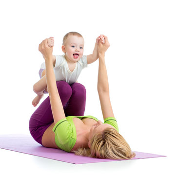 mother with baby boy doing gymnastics