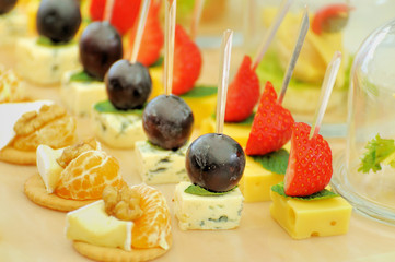 Slices of cheese with fruit for a snack