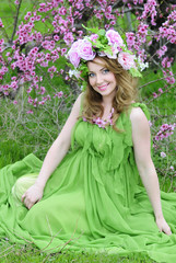 beautiful girl in the flowered garden peach