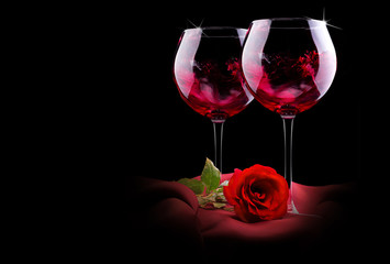 glass of wine with red silk and flower