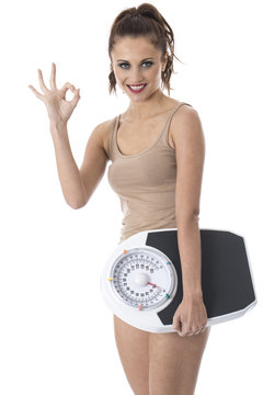 Young Woman Holding Weighing Scales