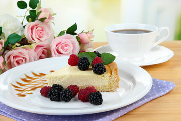 Slice of cheesecake with raspberry and blackberry