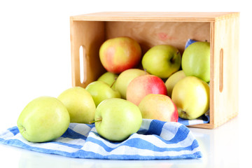 Juicy apples on napkin in box isolated on white