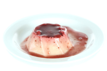 Panna Cotta with raspberry sauce, isolated on white