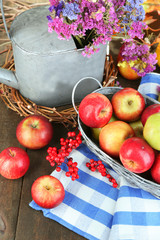 Juicy apples in basket on table close-up