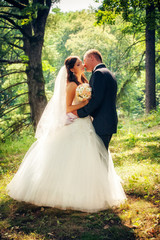 Wedding shot of bride and groom in park