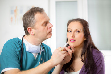 Young woman receiving cosmetic injection