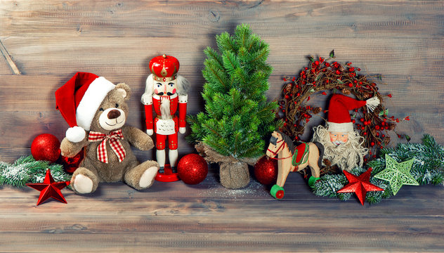 christmas decoration with toys teddy bear and nutcracker