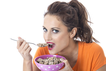 Young Woman Eating Breakfast Cereal