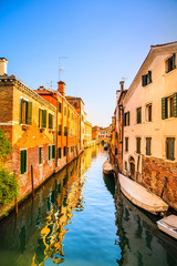 Fototapeta na wymiar Venice cityscape, water canal, bridge and traditional buildings.