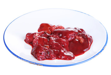 Raw liver on plate isolated on white