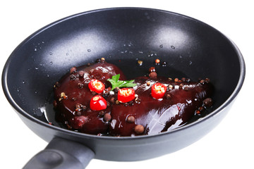 Raw liver in pan isolated on white