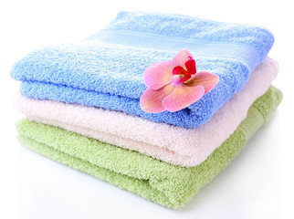 Orchid flower and towels, isolated on white