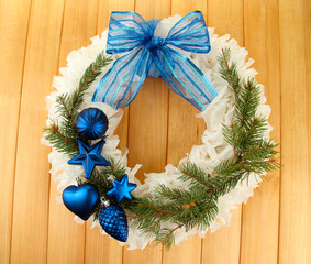 Fototapeta na wymiar Christmas wreath on wooden background
