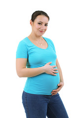 Beautiful young pregnant woman touching her belly isolated