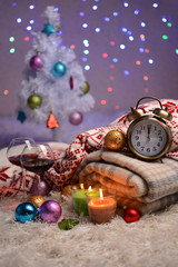 Composition with plaids, candles and Christmas decorations,