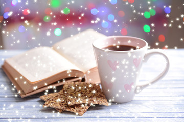 Composition of book with cup of coffee