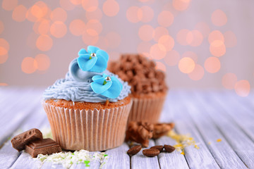 Tasty cupcakes with butter cream,