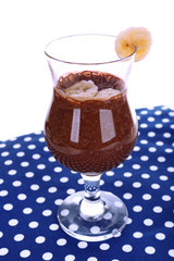 Cocktail with banana and chocolate on table on white background