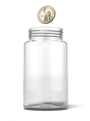 Dollar dropping into an empty jar