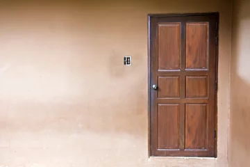 wood door closed on wall. © thirayut Inta
