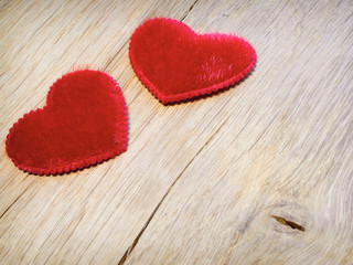 red hearts are on  oak planks