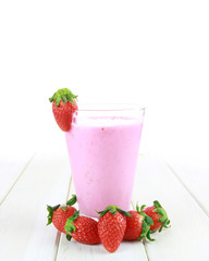strawberry smoothie on a wood