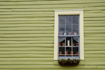 picturesque house with window and flowerpots