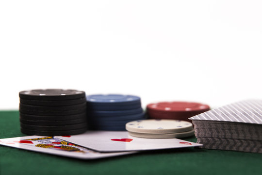 Poker Chips with Cards on White Background