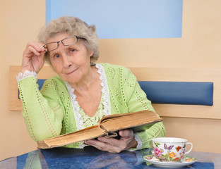 senior woman reading a book