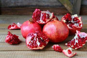 ripe pomegranates on a rustic table