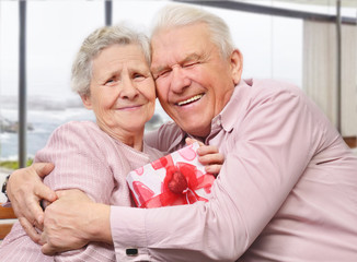 Smiling senior couple hugging