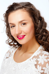 Portrait of smiling girl. Hairstyle, make-up.