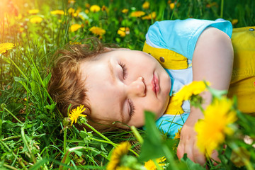 Sleeping boy on grass