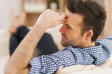Obraz premium Portrait of dreaming man in living room