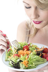 Obraz na płótnie Canvas Young Woman Eating Salad