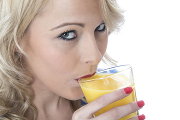 Model Released. Attractive Young Woman Drinking Orange Juice