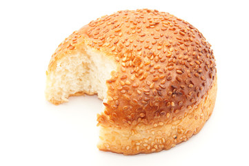 bun with sesame seeds on a white background