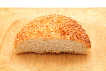 bun with sesame seeds on a white background