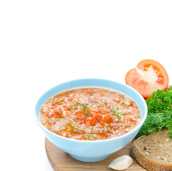 tomato soup with buckwheat groats in a bowl isolated on white