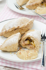 Whole-grain pies with apples and nuts vertical closeup
