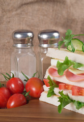 Fresh club sandwich in rustic kitchen setting